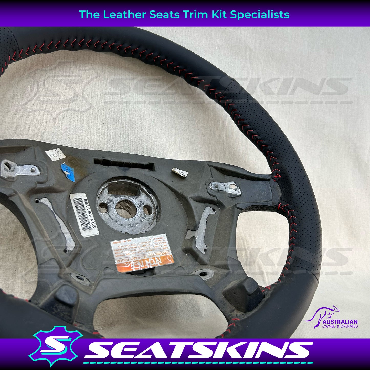 STEERING WHEEL TO FIT HOLDEN VT/VX ANTHRACITE LEATHER RETRIMMED WITH RED STITCH